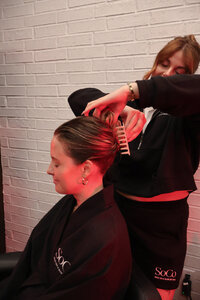 Sleek-back claw clip provided after scalp facial for a polished finish.