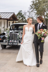 Bride and Groom walk together at Videre Estate, one of Austin’s best wedding venues.