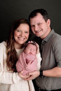 Portrait of Laura, boudoir photographer in Kansas City, with husband and daughter