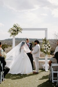 Hill Country Texas ceremony photo of a bride and groom at Camp Hideaway Retreat