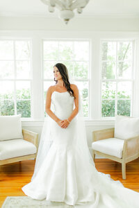 Bridal portrait in an all white suite at Auburn Oaks Farm
