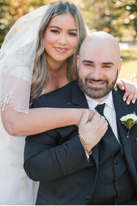 Cuban American couple enjoying their embrace during ceremony.