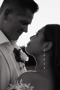 Bride and groom look lovingly into each other's eyes