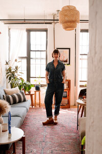 Therapist seated in a cozy Brooklyn office, offering in-person somatic psychotherapy sessions rooted in safety and body-based healing.