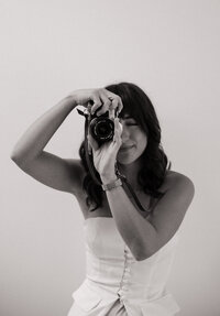 photographer hold up film camera
