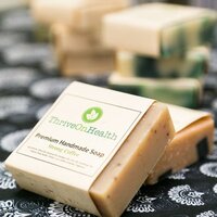 Handmade soaps made by Thrive on Health. Coffee scented soap with coffee beans made naturally