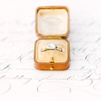 elegant vintage leather ringbox on calligraphy