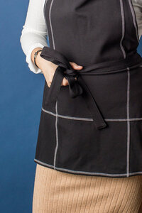 close-up of black apron by Athena Aprons