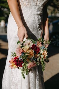 Fall blooms bridal bouquet for a wedding ceremony at Monastery Beach in Carmel-by-the-Sea