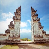couple stands in bali temple indonesia