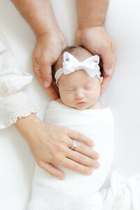 Newborn photography in virginia beach with soft neutrals and natural posing