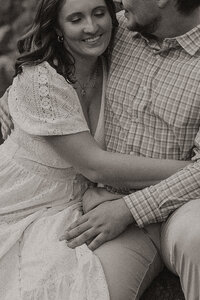 Engaged couple taking engagement photos at Tettegouche Falls in Minnesota