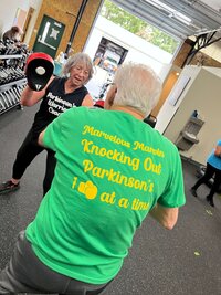 Lori and a warriors in the Parkinson's Warriors gym in Eugene, representing the variety of Parkinson's exercise classes & boxing programs offered. 