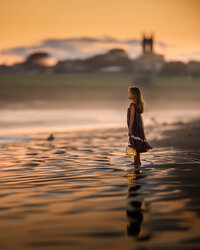 Girl collecting shells at the beach photo by Iya Estrellado Photography.