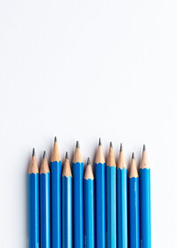 Blue pencils on white background