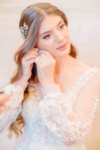 A bride gets ready in the bridal suite at Carolina Country Weddings.