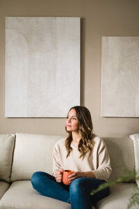 woman looking away on couch