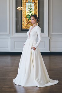 long-sleeve ballgown wedding dress with pockets