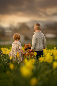 Children with their dog at a daffodil field in Virginia Beach by Iya Estrellado.