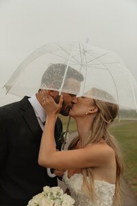 bride and groom share a kiss on wedding day in pei
