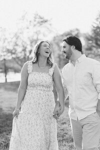 couple laughing at the camera