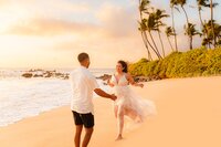 energetic woman runs to her new fiance after their surprise beach proposal on maui