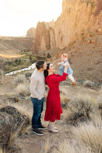 man and woman with small baby girl at smith rock