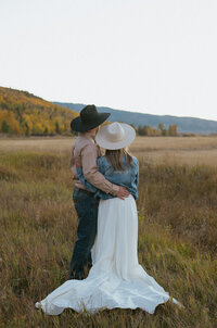 A couple watches the sunset on their Colorado elopement day