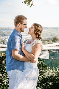 Engaged Couple looking at each other over Bristol Suspenion Bridge