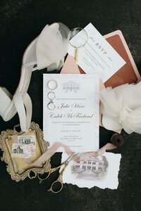 Flat lay of wedding details, including rings, shoes, and flowers, beautifully captured.