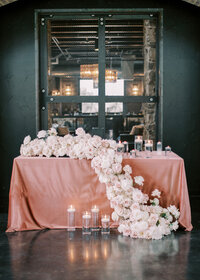 luxury sweetheart table with floral garland
