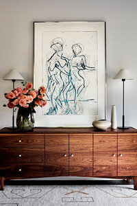 Boston interior decorators showcase a handcrafted walnut sideboard, adding unique character to contemporary New England homes with custom, one-of-a-kind pieces.