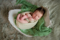 Newborn in belly cast