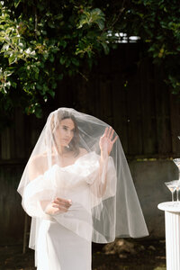 Bride wearing a two layer waterfall style veil