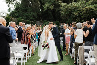 Bride and groom first kiss ceremony organized by seattle wedding coordinator