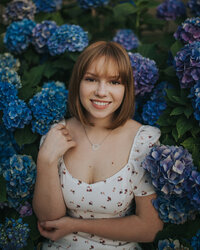 Senior girl surrounded by flowers Tri Cities photographer