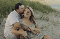 couple embraces on the beach in south florida during a couples photo session