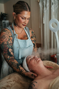 Libby provides gentle neck massage to a client during a facial at her studio in Eugene.
