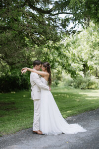 Bride and groom sharing a romantic moment during their portrait session at the Inn at Barley Sheaf Farm in Pennsylvania