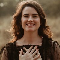 A handsome middle-aged white man with very nice teeth smiles broadly