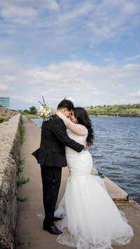 Bride and groom at a waterfront in dubuque ia