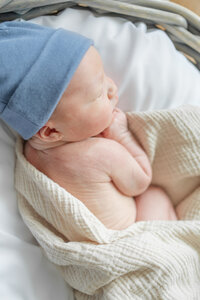 A newborn baby swaddled