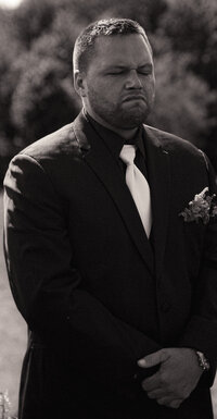 Emotive black and white portrait of  the groom.