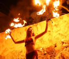Justine Garcia of theangelicflame, performer blending fire dance and aerial arts into dynamic live shows.