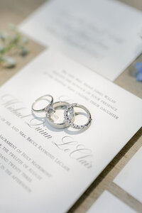 Wedding rings on stationary illuminated by the sun.