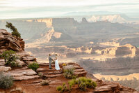a couple stands at deadhorse state park during their sunrise elopement.