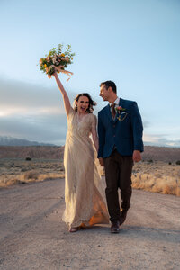 bride and groom holding bouquet