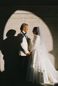 Moody silhouette couple in front of a window