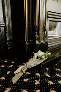 up close shot of bridal bouquet laying on floor