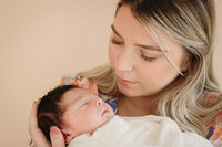 Mum and Newborn Baby at professions phtography session by newborn photographer Lauren Vanier